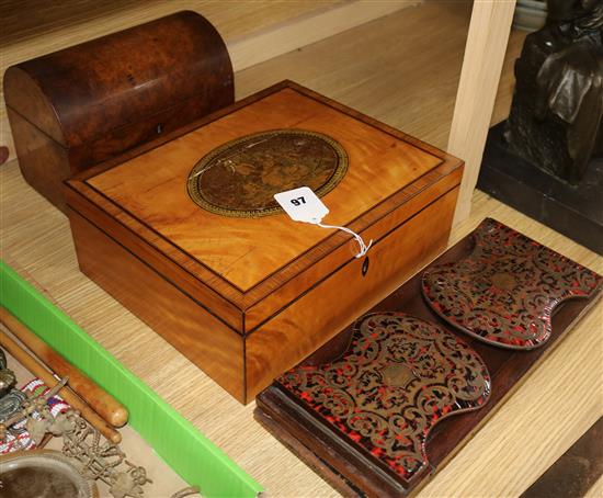 A Regency satinwood work box, a red boullework bookrack and a burr walnut tea caddy
